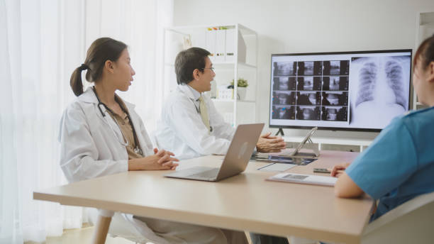 istock Diverse Medical Team Discussing Patient X-rays. 2150771602