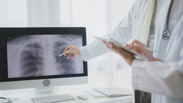 istock Doctor Analyzing Chest X-ray on Computer in Clinic. 2150771633