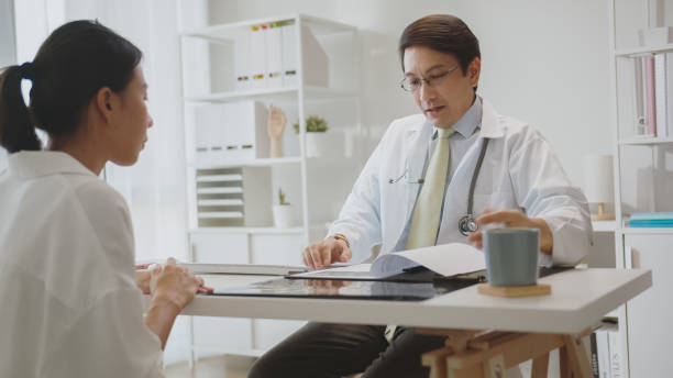 istock Doctor Consultation with Patient in Clinic. 2150771672