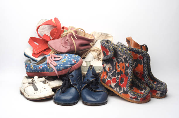 istock Stack of children's shoes on white background 2150775221