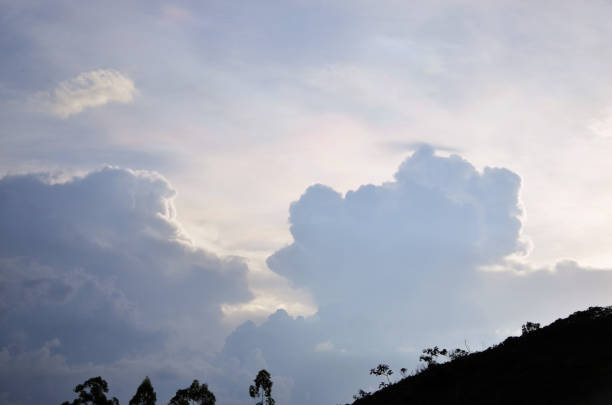 In the sky behind the clouds a soft Irization in the sky in the late afternoon