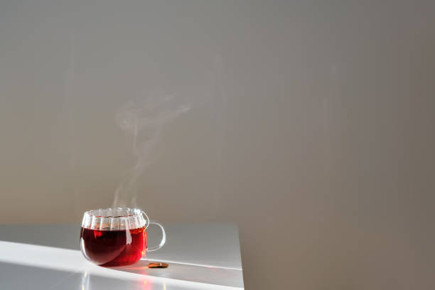 istock Glass mug with hot black tea on the table. 2150776633