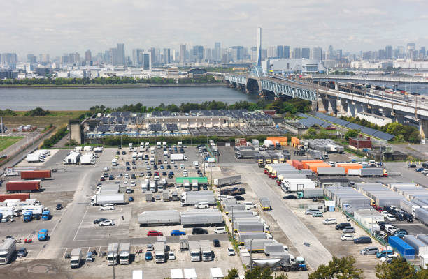 istock Truck parking lot with solar panel power generation system against urban skyline 2150780294