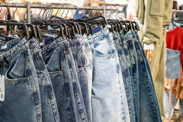 istock Jeans on the rack in the store, selection. 2150784339