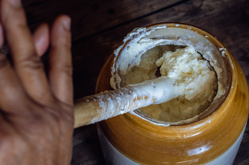 Discover Uttarakhand's Bilona method: curd churned through bilona to extract butter, heated to purify into ghee. Authentic Indian tradition. India