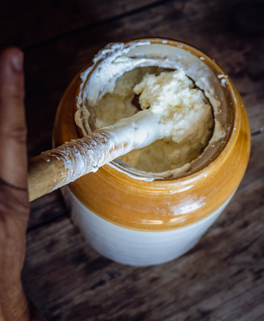 Discover Uttarakhand's Bilona method: curd churned through bilona to extract butter, heated to purify into ghee. Authentic Indian tradition. India