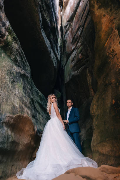 beautiful wedding couple in the mountains with rocks