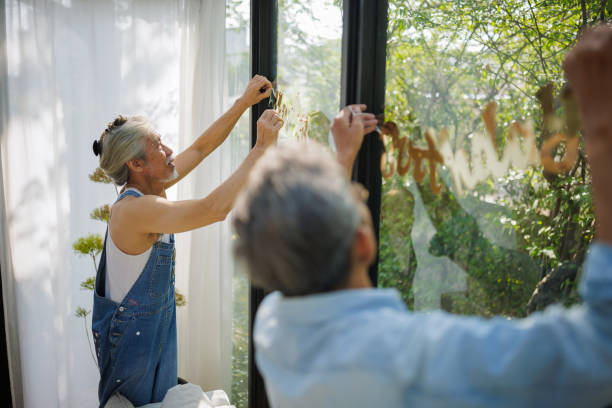 istock Seniors setting up decoration for a birthday party 2150789377