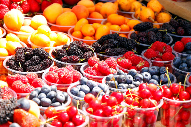 assorted berries fruits in a street stall for sell
