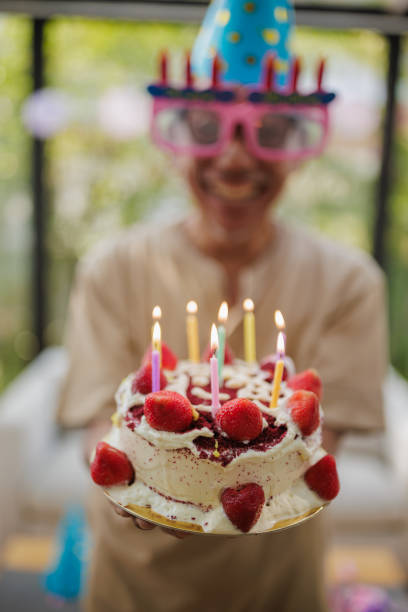 A vintage clown-themed birthday cake with the word \