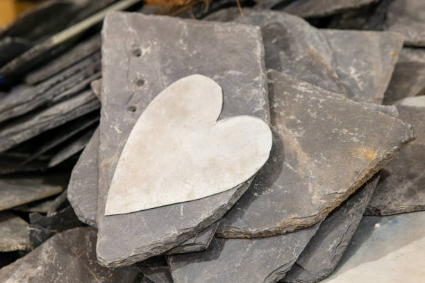 a white heart on slate stones