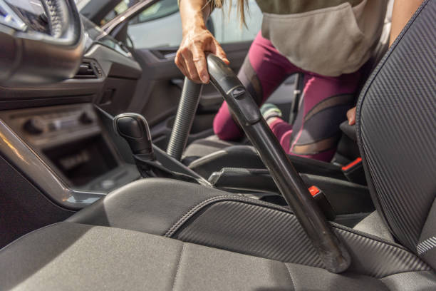 istock A woman vacuuming a car seat 2150792653