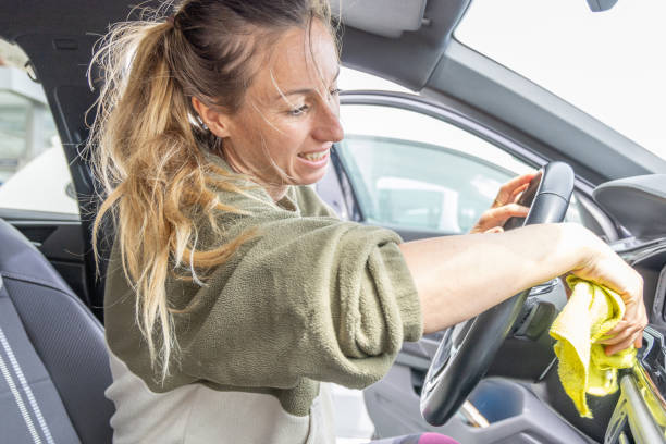 istock Happy woman keeping a car clean 2150792780