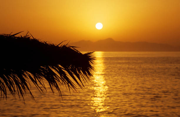 Twilight background of sunset over the tropical ocean