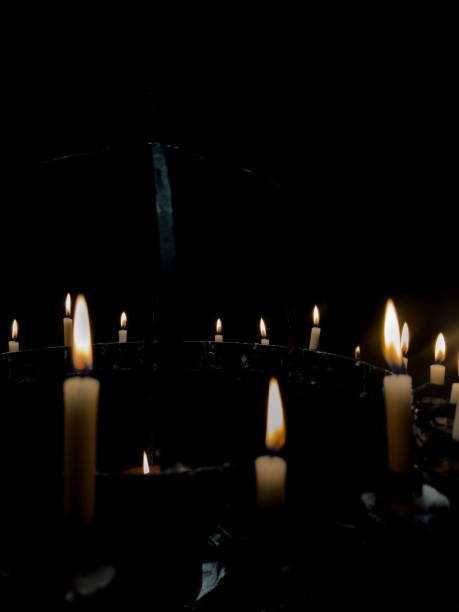 istock candles in the night or isolated on black background 2150793419