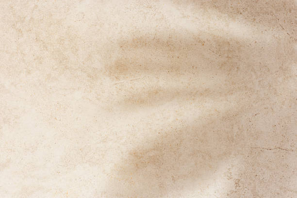 istock Natural palm leaf shadow on light beige sandy color background with empty space. Summer minimal concept, daylight in sunny day, top view plant sun shade, nature environment pattern, neutral tone 2150794972