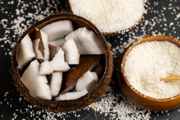 istock white coconut pulp and dried coconut flakes 2150795150