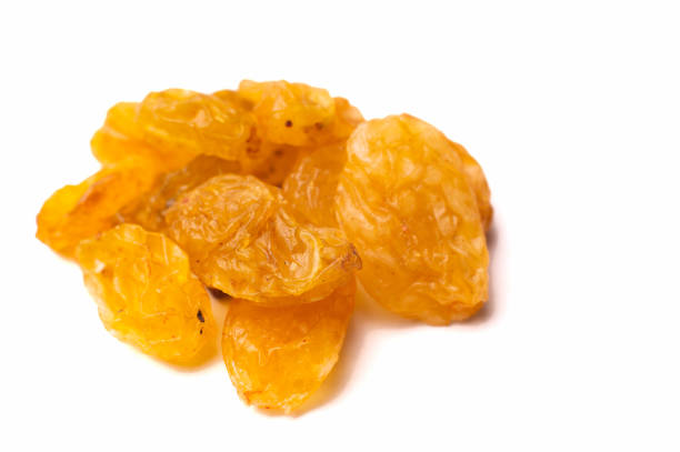istock Falling yellow raisins isolated on white background with clipping path 2150795496