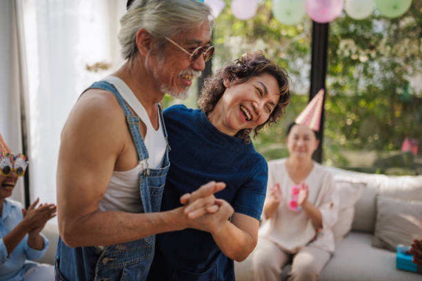 istock Smiling couple dancing at a birthday party 2150795818