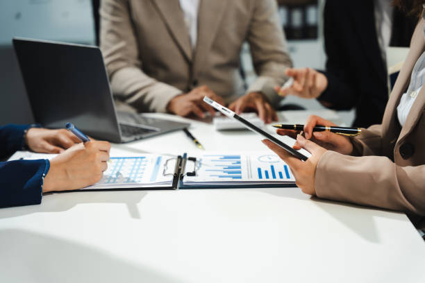 istock Businessmen team or financial data analysts working with tablets and laptop computers and data graphs together. Plan to analyzing projects in the office. 2150797568