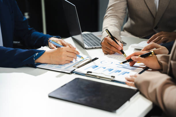 istock Businessmen team or financial data analysts working with tablets and laptop computers and data graphs together. Plan to analyzing projects in the office. 2150797573