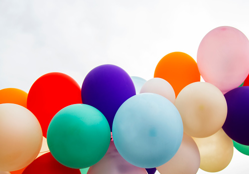 Colorful balloons on sky background. Birthday party, celebration concept.