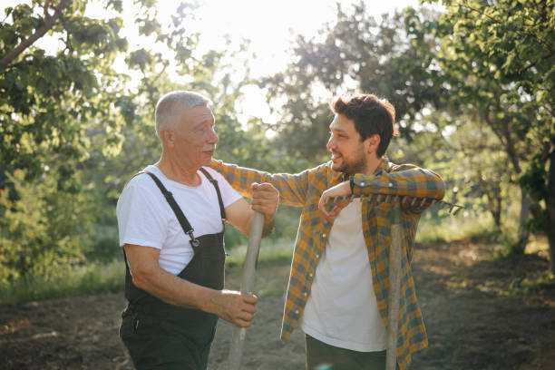 istock Two happy farmers talking on an agricultural field. 2150799885