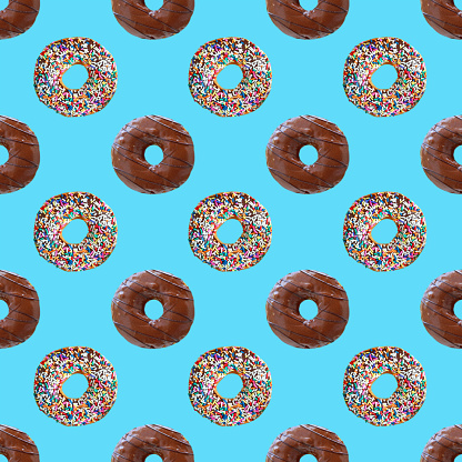 Seamless Pattern of Two Types of Delectable Chocolate Glazed Donuts on Sky Blue Backdrop