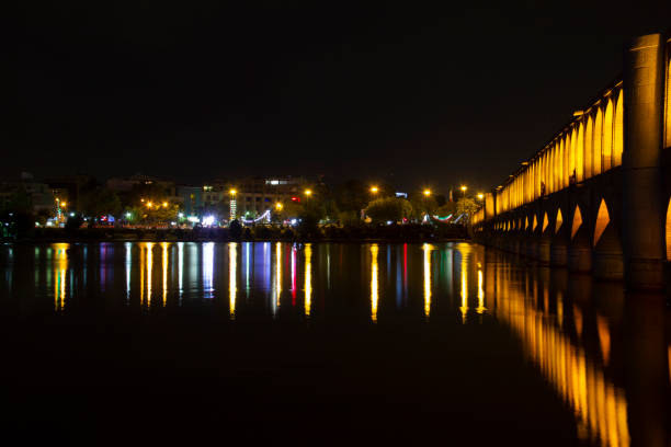 the beautiful view of the city of Isfahan and the zayandeh rud River at night and the thirty-three bridge (siose pol) of this city, which have a special view at night with lighting