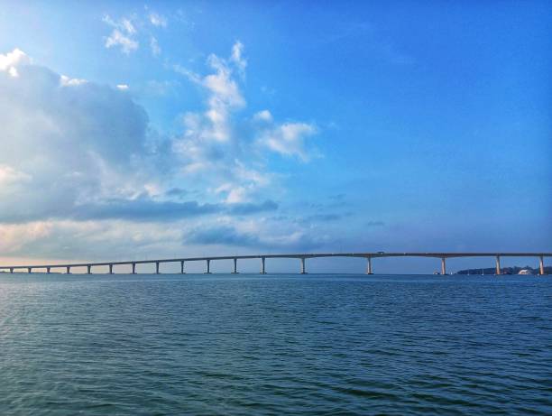 istock Beautiful blue sky and calm sea with bridge 2150800699