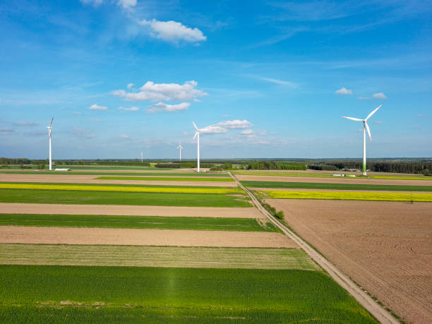 istock Spring farmlands and electric windmills. 2150800851
