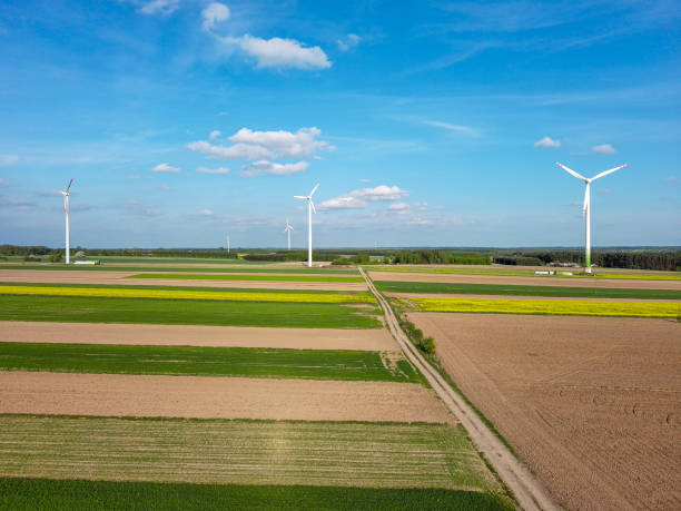 istock Spring farmlands and electric windmills. 2150800897