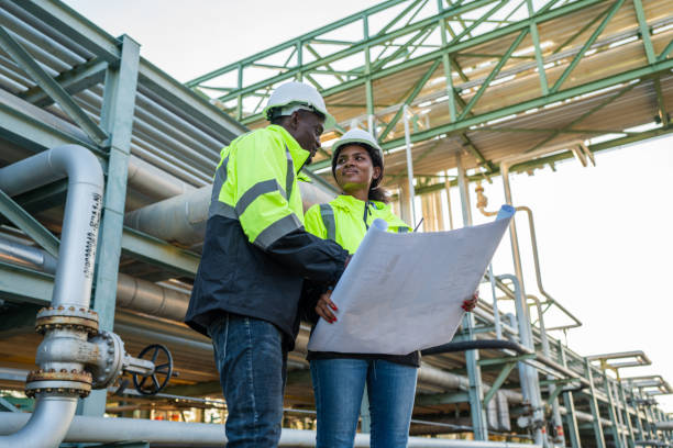 istock Mechanical engineer holding blueprint drawing to checking and inspection. 2150801329