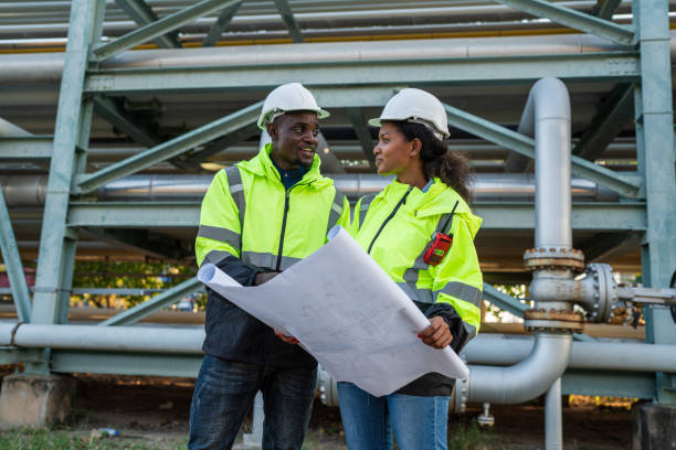 istock Mechanical engineer holding blueprint drawing to checking and inspection. 2150801389