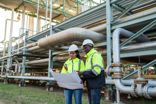 istock Mechanical engineer holding blueprint drawing to checking and inspection. 2150801390