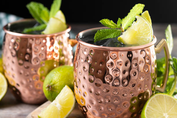 istock Moscow mule cocktail served with ice and lime slice on wooden table 2150801522