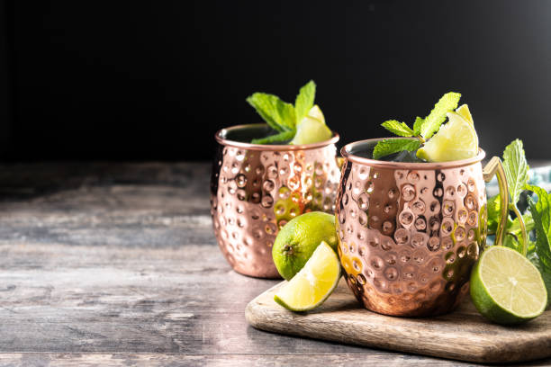istock Moscow mule cocktail served with ice and lime slice on wooden table 2150801552