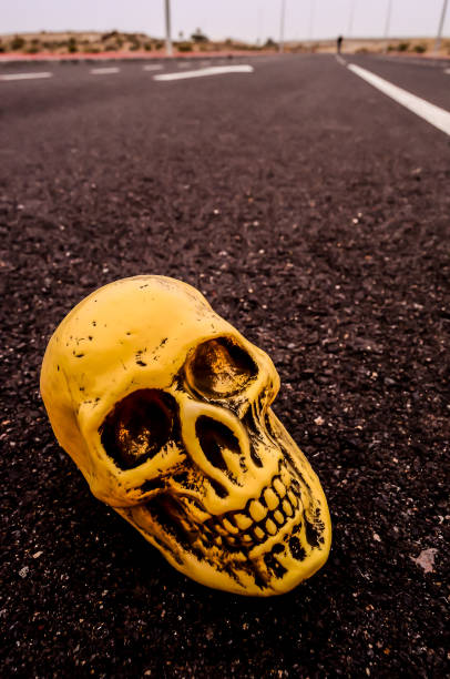 Road Death Concept Skull on the Asphalt Street