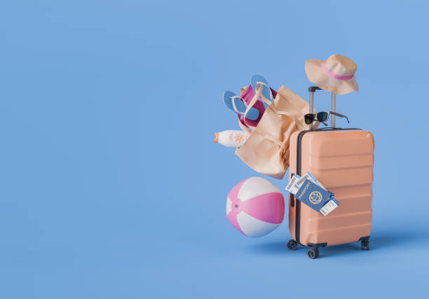 istock Summer Vacation Essentials with Luggage and Beach Accessories on Blue Background 2150802198