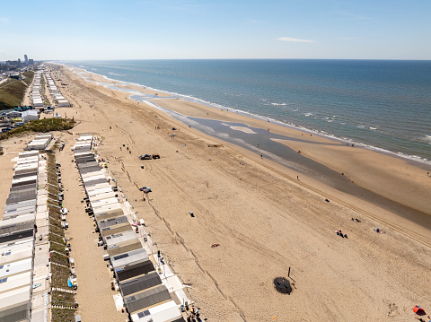 Cabins at the beach at the North Sea shore near Zandvoort in North Holland, The Netherlands seen from above during a beautiful summer day.