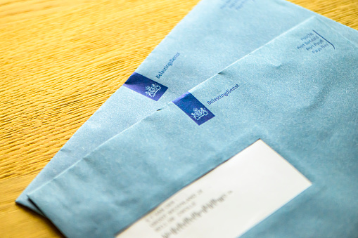 Dutch tax envelope of the Netherlands tax office Belastingdienst. The Tax and Customs Administration is part of the Dutch Ministry of Finance and is amongst other tasks responsible for levying and collecting taxes in the Netherlands/