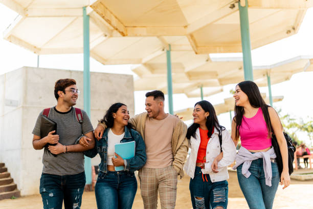 istock Young student friends talking and walking outdoors 2150802454