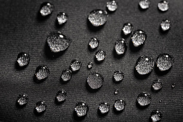 istock Close-up view on water drops on waterproof impregnated fabric in rain 2150802803