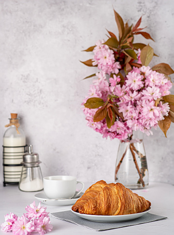 Food photograph of Croissant; Coffee; Cappuccino; Breakfast; Caffeine; Baked; Flower; Gourmet; Eating; Latte; Table; Restaurant; Brown; Cafe; Appetiser; Plate; Morning