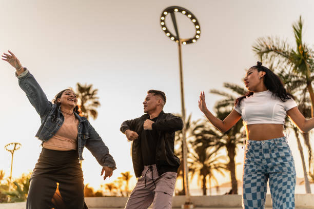 istock Friends dancing outdoors 2150804310