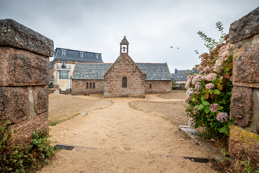 small chapel on the coast of french brittany. View at the Chapel of Saint Guirec at Atlantic seafront near Ploumanach in Brittany, France