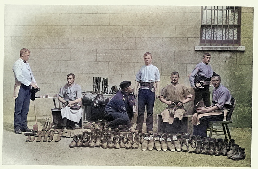 Vintage picture British army Regimental shoemakers making boots for soldiers, Victorian Military History, 1890s 19th Century.