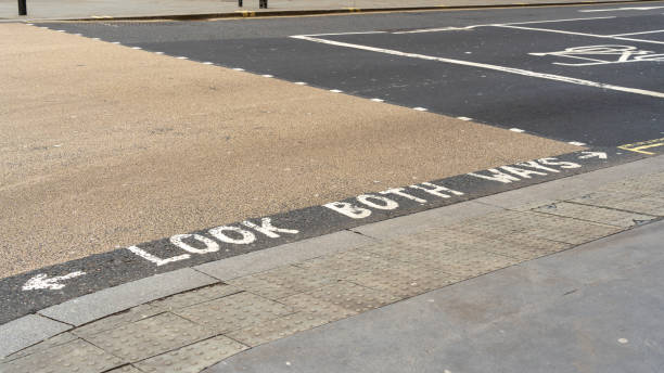 istock Look both ways written on a pedestrian crossing 2150805937