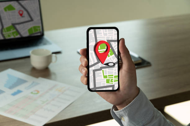 istock Hand Holding Cphone With Navigation LOCAL map Online Shopping And Local Shop Support 2150806535