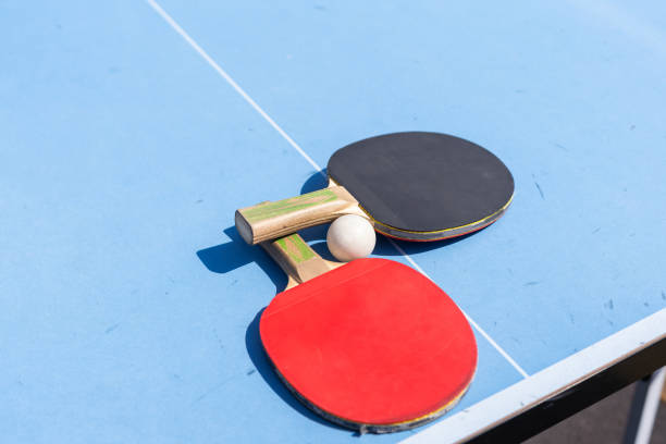 istock table tennis ball and paddle 2150806755